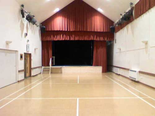 Main Hall with stage extension and lighting.
